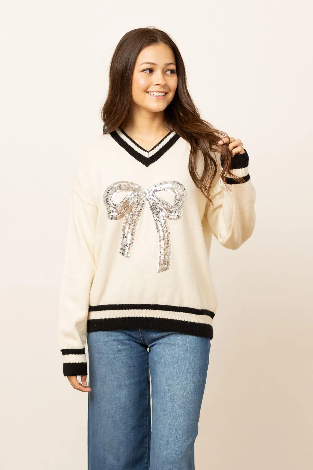 Silver Sequin Bow on Cream Varsity Sweater